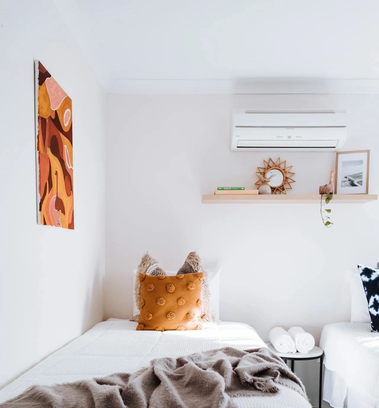 Wall-mounted air-con unit on a bedroom wall